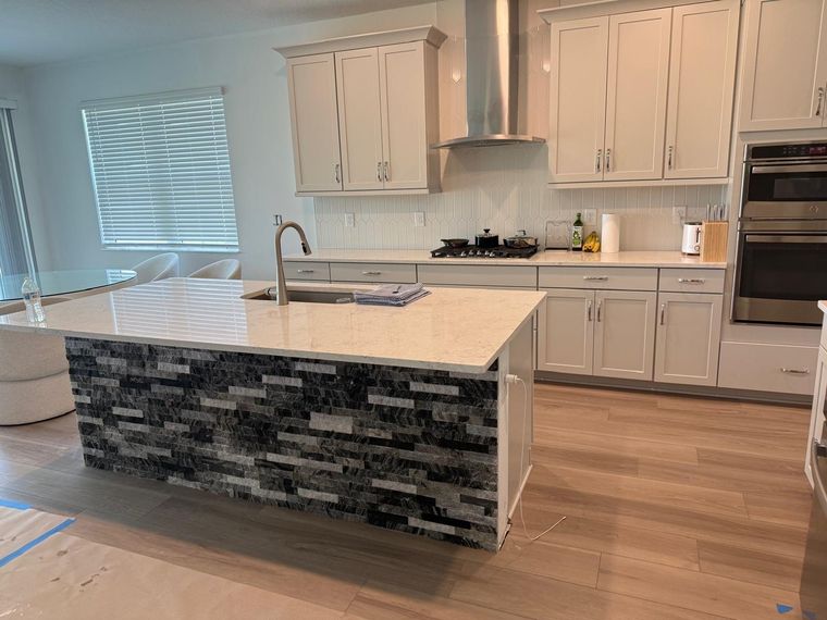 Kitchen island with stone facing